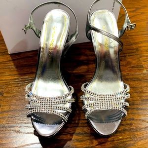 Brand new Caparros silver heels size 8